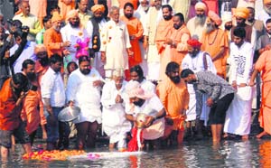 Ashes of Mahant Rajendra Das of Bada Akhada Udasin being immersed in the Ganga at Braham Kund, Har-ki-Pauri, in Haridwar. 