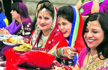 Women offer puja on the occasion of Karva Chauth in Karnal on Friday.
