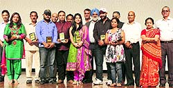 Dr MPS Ishar, Vice-Chancellor, University of Jammu, felicitates the dogri film Reets artists and their team during the special show organised at General Zorawar Singh Auditorium in Jammu