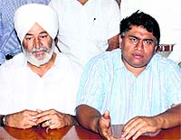 District president of the PPP Dr Navjot Dahia (right) addresses the media in Jalandhar on Friday