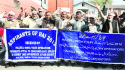 Haj aspirants hold a protest in Srinagar on Friday. Tribune photo: Mohd Amin War