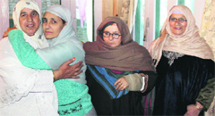 A pilgrim hugs a relative after returning from Saudi Arabia on Friday. Tribune photo: Mohd Amin War