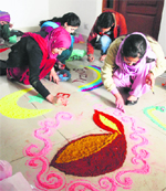 Students make rangolis during Sonzal-2012 on the university campus in Srinagar on Friday. Tribune photo: Yawar Kabli