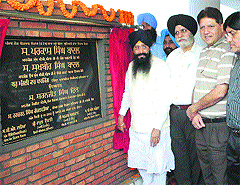 PWD minister Sharanjit Singh Dhillon (extreme left) inaugurates the multi-level parking lot at the Mini-Secretariat in Ludhiana on Friday. 