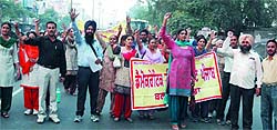 Members of the Democratic Teachers Front staging a march to condemn the action of the municipal councillor, who had thrashed a government elementary teacher, near the Mini-secretariat in Bathinda on Saturday