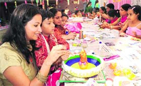 Women with their children decorate diyas at Tribune Model School in Sector 29, Chandigarh, on Saturday