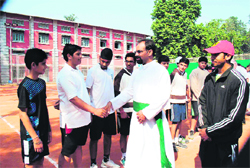 Brother AJ George, Principal, St Josephs Academy, being introduced to players at the inauguration of the Brother SE Coffey Memorial Tennis Tournament in Dehradun on Saturday. 