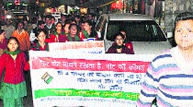 ITI students hold a candlelight march at Dharampur in Kasauli