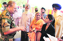Station Commander, Beas, Brig MS Tomar, interacts with dependents and veer naris at Rayya.