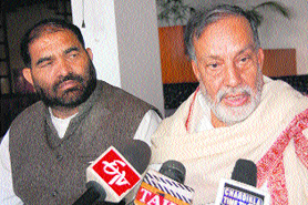 Panthers Party chairman Bhim Singh (right) addresses a press conference in Jammu on Saturday.