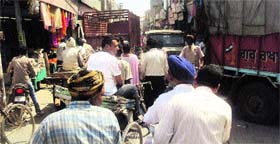 Vehicles stuck in a traffic jam on College Road in Jagraon.