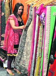 A woman takes a look at a bridal attire during an exhibition in Ludhiana.