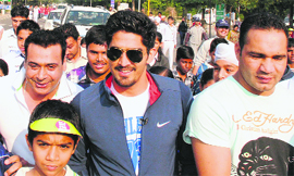 Olympic boxer Vijender Singh takes part in a walk at Sukhna Lake in Chandigarh on Sunday. 