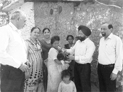 Civil Surgeon Jaswant Singh administers polio drops to a child at Sirhind town on Sunday. 