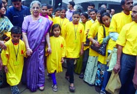 Gursharan Kaur, wife of Prime Minister Manmohan Singh, with schoolchildren during a Cervical Cancer Awareness Walk in New Delhi on Sunday