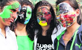 Volunteers of the Citizens for Green Doon with painted faces in Dehradun on Sunday