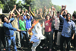 Members of National Secular Forum (NSF) stage a protest against Naxalism in Jammu on Sunday. 