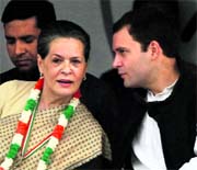 Rahul Gandhi makes a point to Sonia Gandhi at the rally venue.