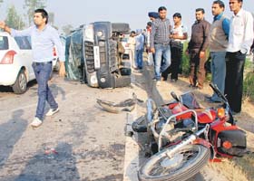 The mangled remains of a motorcycle and a car on the Ambala-Chandigarh highway at Dera Bassi on Monday
