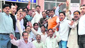 People protesting against shortage of medicnes at General Government Hospital in Haridwar on Monday.