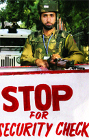 A security personnal on guard on the first day of the re-opening of the civil secretariat in Jammu on Monday.  PTI