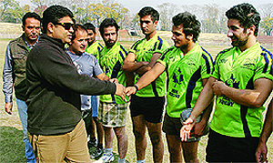 Jammu and Kashmir Rugby Association president Sarmad Hafeez interacts with players during the flagging-off ceremony in Srinagar on Sunday. The 15-member team left for Pakistan to take part in a week-long sports festival. 