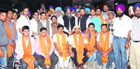 Prem Singh Chandumajra and Dr Harbans Lal with the Congress workers who joined the SAD.