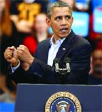 President Barack Obama (left) speaks at a campaign event in Cincinnati.