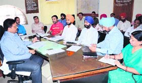 MC officials conduct a meeting with the House Tax recovery team in Amritsar on Tuesday