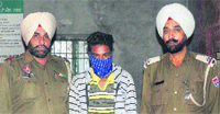 Accused Harjeet Singh in police custody at the Mullanpur police station on Tuesday. Tribune photo: S Chandan
