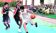 Players in action during a match in the Asian Challenge Basketball Tournament in Dehradun on Tuesday. Tribune photo: Vinod Pundir
