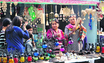 Shoppers throng stalls of brass and wrought iron handicrafts at Saras Mela in Dehradun on Tuesday. Tribune Photo: Vinod Pundir 
