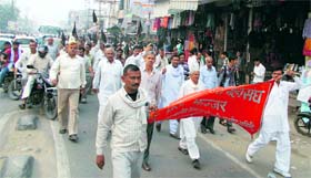 Employees take out a protest march in Jhajjar on Tuesday.