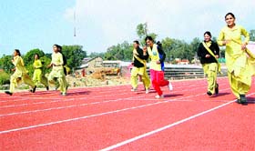 Girl students of the junior basic training course compete in a race during the annual sports meet in Dharamsala on Tuesday.