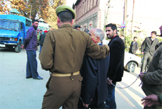 The owners of Hajeej travel agency being produced in the local court in Srinagar on Tuesday. 