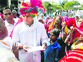 Minister of State for Corporate Affairs Sachin Pilot listens to the problems of villagers at Ramgarh in Ajmer on Tuesday. 