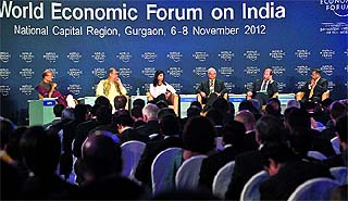 TCS CEO & MD Natarajan Chandrasekaran (R), Law Minister Ashwani Kumar (3R), Harvard University economics professor Gita Gopinath (3L), Bajaj Auto chairman Rahul Bajaj (2L) and Indian Express editor Shekhar Gupta (L) listen to Nestl CEO and co-chair of the World Economic Forum on India Paul Bulcke (2R) during the World Economic Forum summit in Gurgaon on Wednesday. Canadian Prime Minister Stephen Harper and Britain's former Premier Gordon Brown are among the top draws along with other corporate honchos at the three-day Indian edition of the WEF