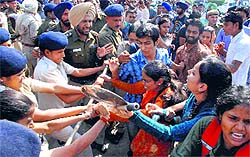 Police personnel stop students from entering the VC's office at Panjab University on Wednesday
