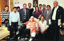 Governor Aziz Qureshi with officials of Census Operation, Uttarakhand, in Dehradun on Wednesday. A Tribune photograph