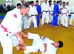 Former world champion and Olympic silver medallist Neil Adams teaching judo techniques to national- level coaches at Gurukul Kangri University in Haridwar on Wednesday.