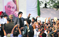 Shah Rukh Khan waves to students at Doaba College in Jalandhar on Wednesday. Photo: Sarabjit Singh