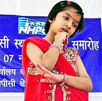 A girl performs on the occasion of NHPC Day in Katra on Wednesday