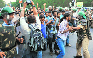 Students and riot police tussle at Osmania University in Hyderabad on Wednesday. 
