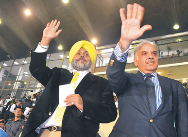 Punjab Deputy Chief Minister Sukhbir Singh Badal and Chief Minister of Pakistan's Punjab Shahbaz Sharif at a sports event in Lahore on Wednesday. 