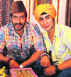 Ajay Devgn (L)