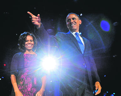 US President Barack Obama celebrates with First Lady Michelle Obama on stage on election night in Chicago.