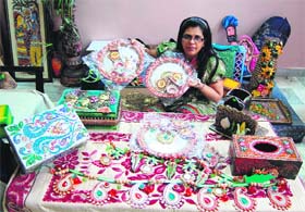 Bharti Malhotra, owner of Bharti Arts, shows some gift options