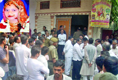 Delhi police officials and neighbours outside Satyam Yadavs (Inset) house at Nangloi in New Delhi 
