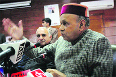 Chief Minister PK Dhumal addresses mediapersons in Shimla on Thursday.