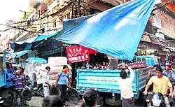 employees of the MCs tehbazari department clear encroachments from streets to pave way for fire brigade vehicles in Jalandhar on Thursday